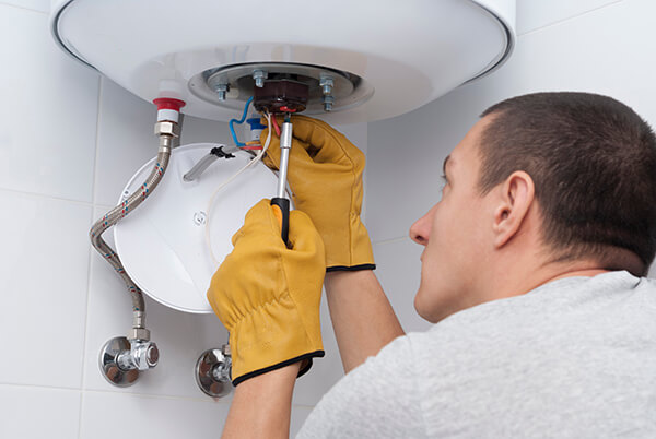 Plumbers for hot water tank replacement.